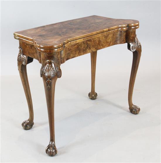 A fine George I figured walnut card table, W.2ft 10in. D.1ft 5in. H.2ft 5in.